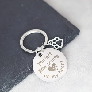 Silver stainless steel pet memorial keychain with engraved You Left Paw Prints on My Heart