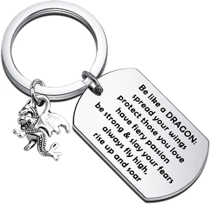 Detail view of dragon keychain with engraved stainless steel plate and round charm