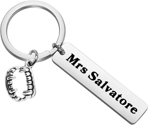 Close-up of silver stainless steel keychain with Mrs Salvatore tag and vampire fangs