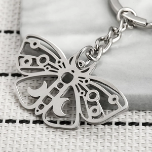Hollow moth keychain with crescent moon design in silver stainless steel for backpacks