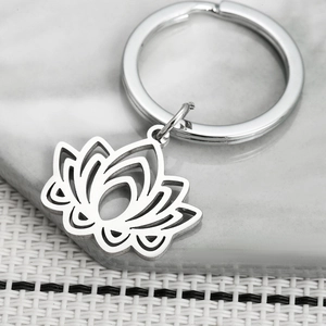 Minimalist stainless steel lotus flower keychain with a modern cutout pendant design