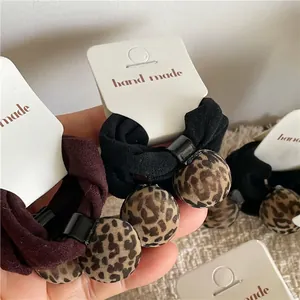 Fashionable leopard print ball hair tie set with high elastic bands on display cards