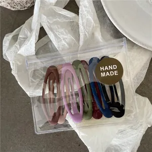 Set of 7 matte colorful oval BB hair clips for girls in a handmade gift package