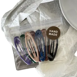 7-piece colorful matte oval BB hair clips set in a transparent handmade zipper bag