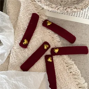 Five-piece set of red velvet rectangular hair clips with gold heart metal accents