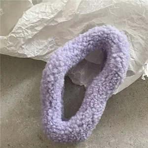 Close-up detail of soft lavender purple plush hair scrunchie with fluffy faux fur texture