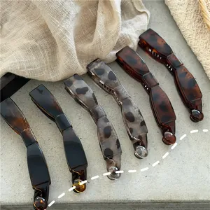 Set of six leopard print banana hair clips in dark brown and tortoise shell resin
