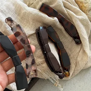 Elegant leopard print and solid color banana hair clips with non-slip resin teeth