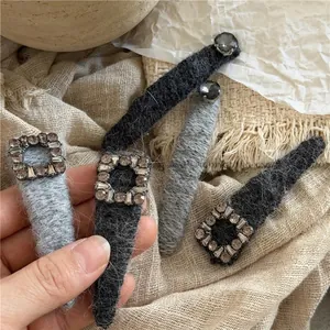 Elegant plush hair clips with square rhinestones in grey and dark grey tones