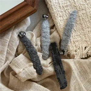 Luxe gunmetal square crystal hair clip with knit fabric texture in grey tones
