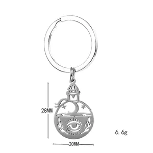 Silver stainless steel keychain with mystical moon star and eye cutout pendant