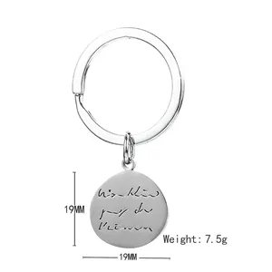 Polished stainless steel round keychain with engraved text, 19mm silver metal pendant