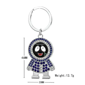 Porte-clés hip hop en métal avec strass bleus et blancs sur un petit personnage cartoon