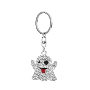 Close-up of sparkling rhinestone ghost keychain with winking face and red tongue detail