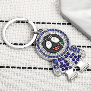 Porte-clés style hip hop avec personnage cartoon et strass étincelants bleus et blancs