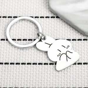 Detailed macro view of a polished stainless steel bunny pendant on a round silver keychain