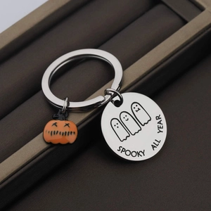 Spooky All Year stainless steel keychain with ghost engraving and orange pumpkin charm