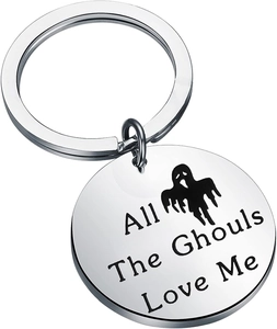 Close-up of All The Ghouls Love Me engraving on polished stainless steel keychain