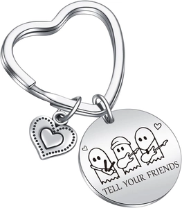 Macro detail of Tell Your Friends music ghost engraving on stainless steel keychain