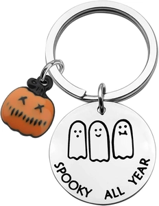 Detail of Spooky All Year stainless steel keychain with orange pumpkin and ghost charms