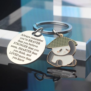 Cute panda stainless steel keychain with inspirational quote on blue glass background