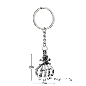Vintage punk skull hand keychain in retro silver alloy for Halloween gifts and car decor