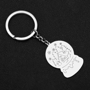 Snowflake crystal ball keychain with engraved winter forest scene in silver stainless steel