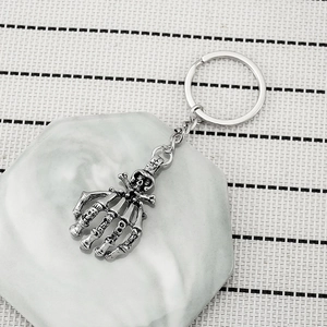 Retro skeleton hand keychain in antique silver with ROCK engraving for Halloween gifts