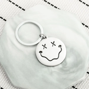 Minimalist hollow smiley face stainless steel keychain with polished silver metal finish