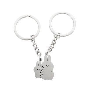 Polished stainless steel puzzle keychains featuring two cute hugging rabbits for couples