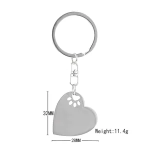 Heart-shaped stainless steel keychain with paw print cutout for pet lovers gift