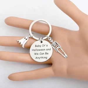 Halloween ghost skeleton stainless steel keychain with engraved round charm on hand model