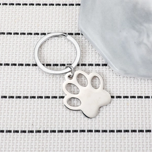 Polished stainless steel cat paw keychain with cutout design for pet lovers