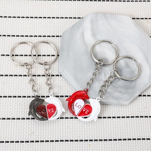 Porte-clés couple dauphin avec pendentif cœur en alliage de zinc pour sac à main