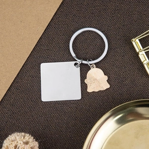 Polished stainless steel Trick or Treat ghost keychain with customizable square metal pendant