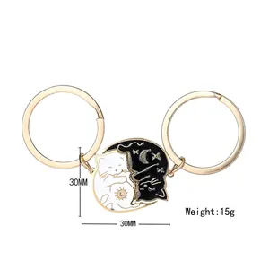 Simpatici portachiavi coppia gatto bianco e nero con sole e luna in acciaio inox stile yin yang