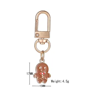 Cute gingerbread man keychain with red bow and gold clasp for Christmas bags