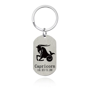 Detail of silver stainless steel keychain with brushed Capricorn zodiac sign engraving