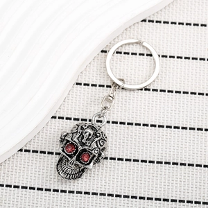 Porte-clés crâne punk gothique en argent vintage avec yeux en strass rouges pour cadeau