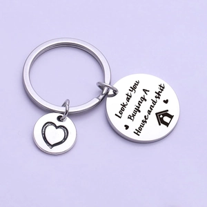 Polished stainless steel housewarming keychain with engraved humorous house blessing