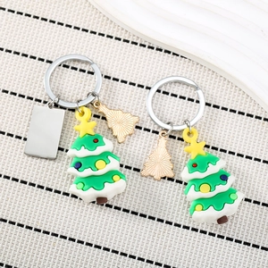 Christmas tree PVC keychain with stainless steel plate and gold metal charm on woven mat