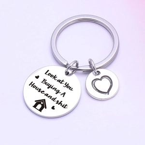 Polished stainless steel housewarming keychain with funny engraved congratulatory text