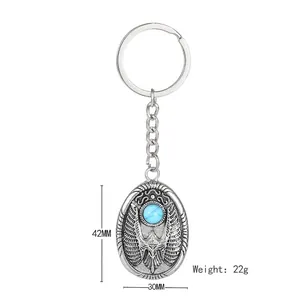 Vintage eagle keychain with turquoise stone and wings relief weighing 22g