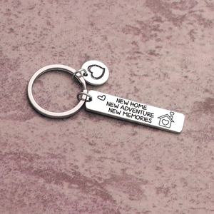 New home keychain in stainless steel with engraved adventure memories quote and house icon