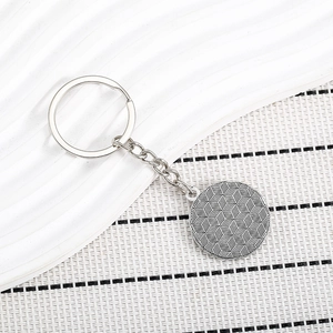 Silver tree of life keychain with hexagonal honeycomb texture and metal links