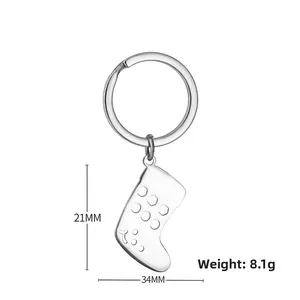 Detail view of silver stainless steel Christmas stocking keychain with 21mm size specs