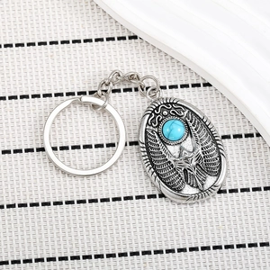 Vintage silver eagle keychain with turquoise stone and Egyptian scarab totem engraving