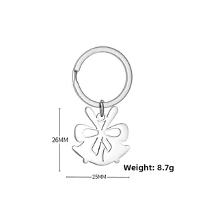 Close-up of a silver Christmas bell pendant keychain with dimensions 26mm by 25mm