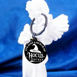 Halloween Hocus Pocus keychain with black witch hat design on blue background
