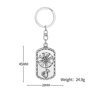 Rotating sunflower keychain with retro money bag pendant in silver stainless steel finish